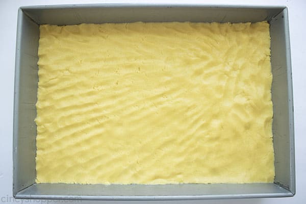 Cake batter in bottom of pan