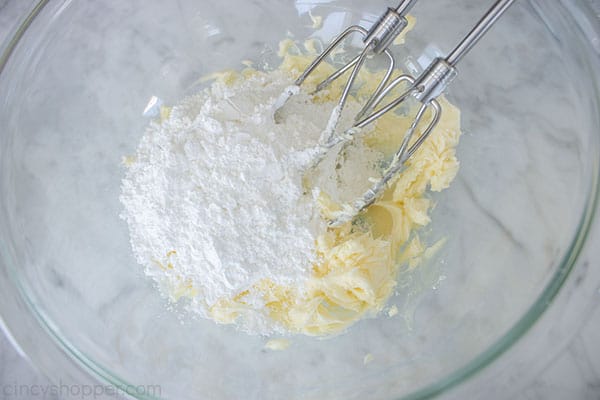 Powdered sugar added to creamed butter