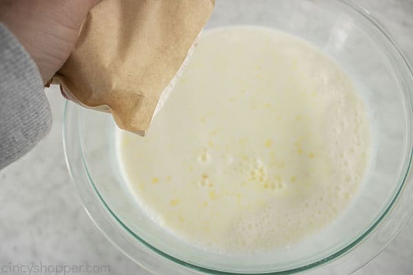 Pudding mix and milk in a bowl