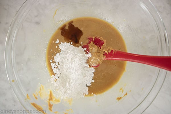 Vanilla and powdered sugar added to peanut butter mixture