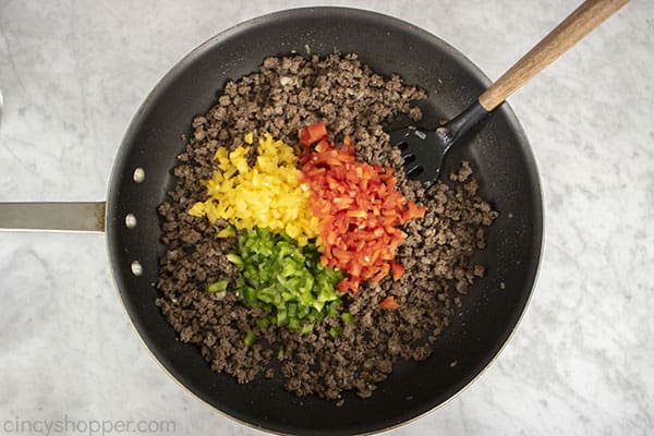 Diced peppers added to pan
