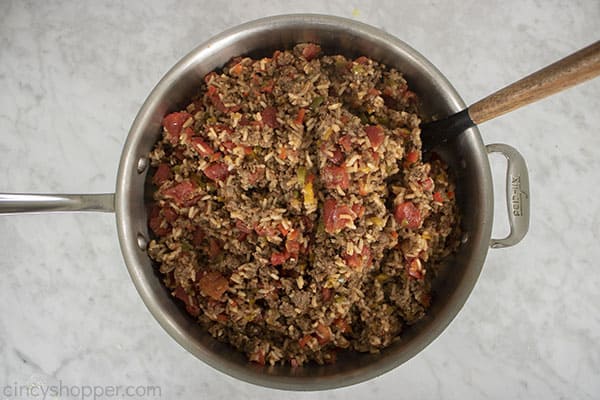 Mixed stuffed peppers in skillet