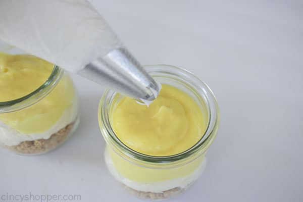 Adding whipped topping to jar