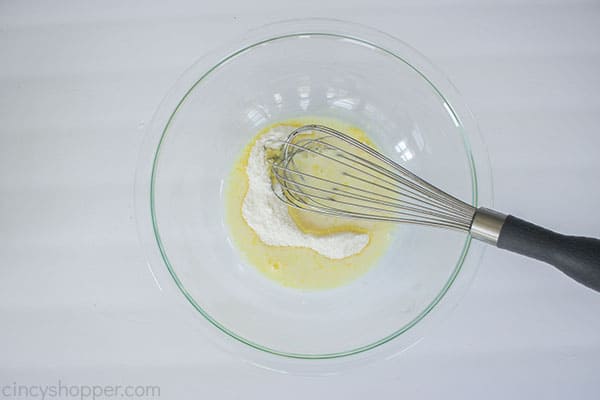 Lemon Pudding mix with milk in a bowl