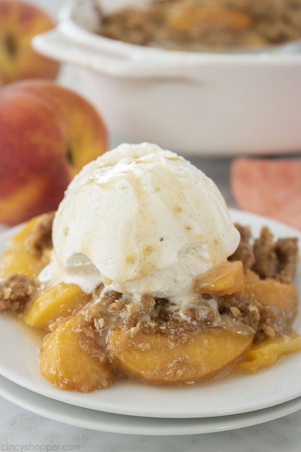 Homemade Peach Crisp on plate with ice cream