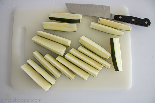 Zucchini cut in spears on a cutting board