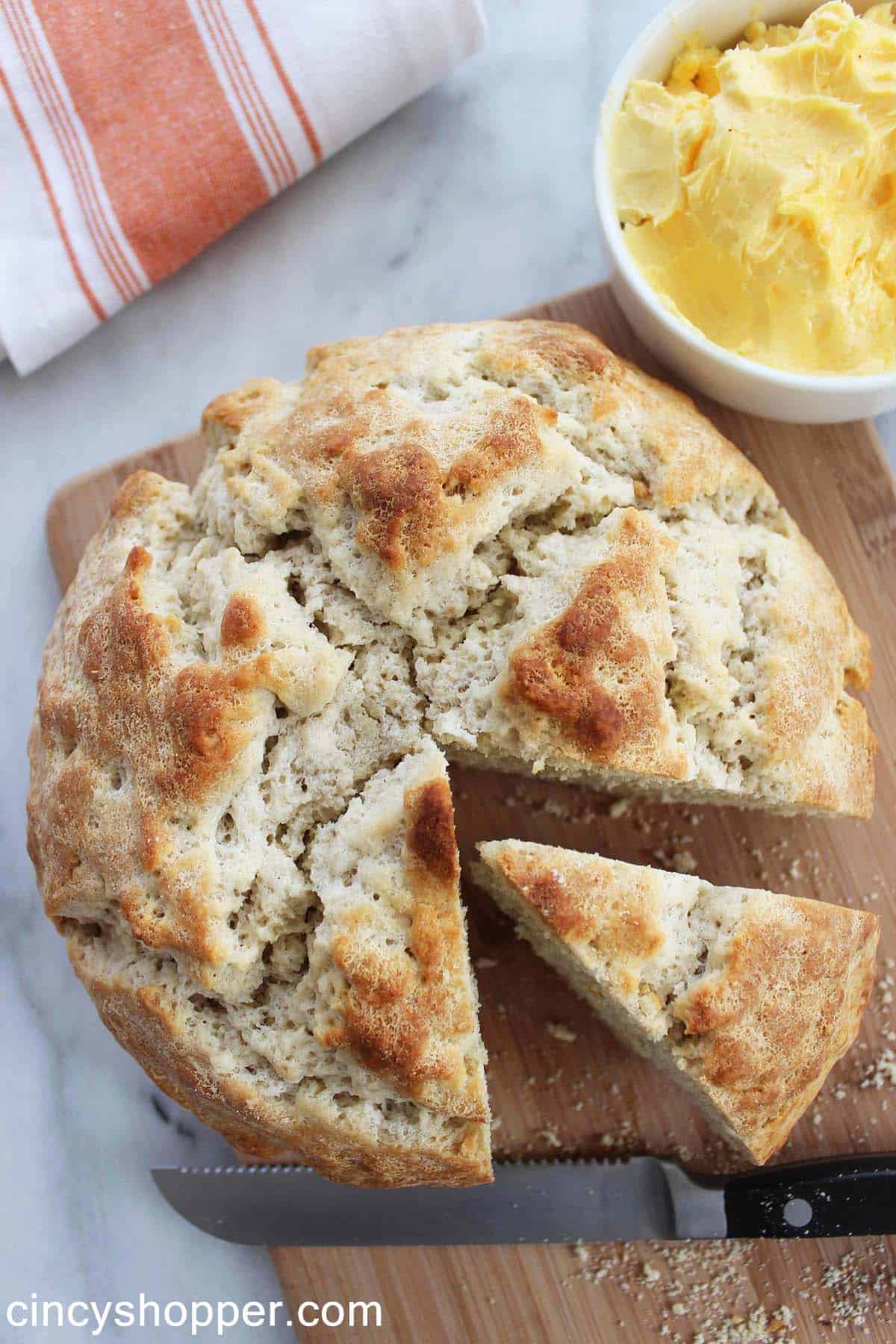  Whole Soda Bread loaf on a cutting board