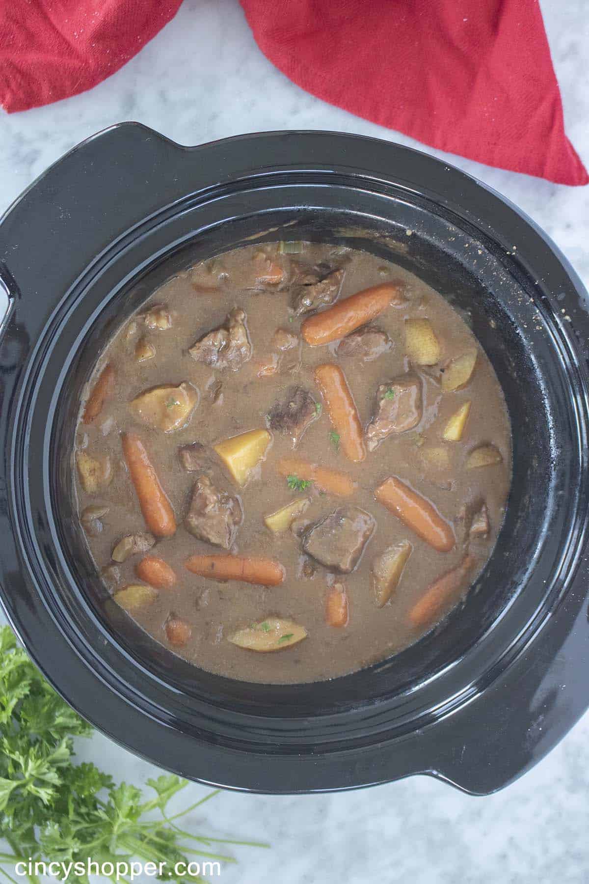 Slow Cooker filled with beef stew.