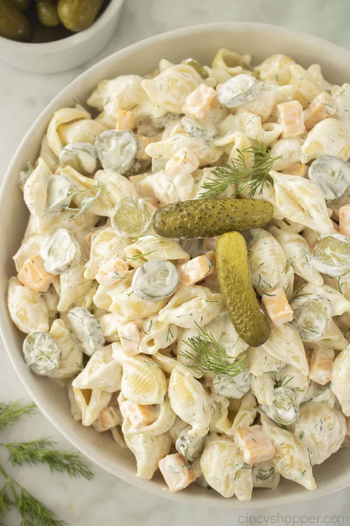 Dill Pickle Pasta Salad in a white bowl.