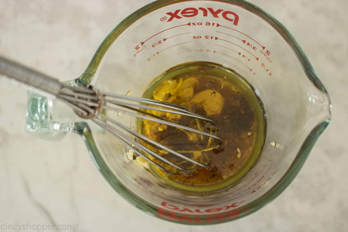 Mixing homemade dressing in a measuring cup