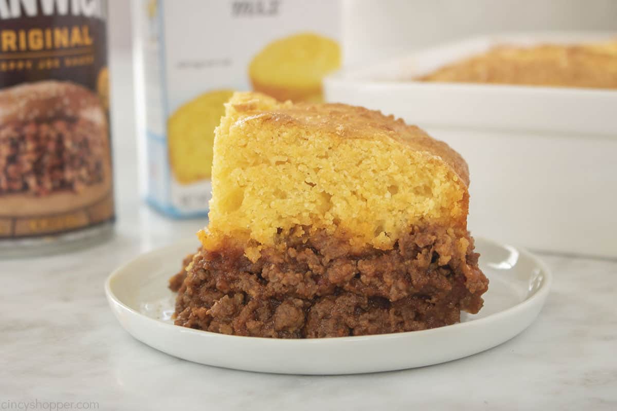 Sloppy Joe Casserole with cornbread on top on a plate.