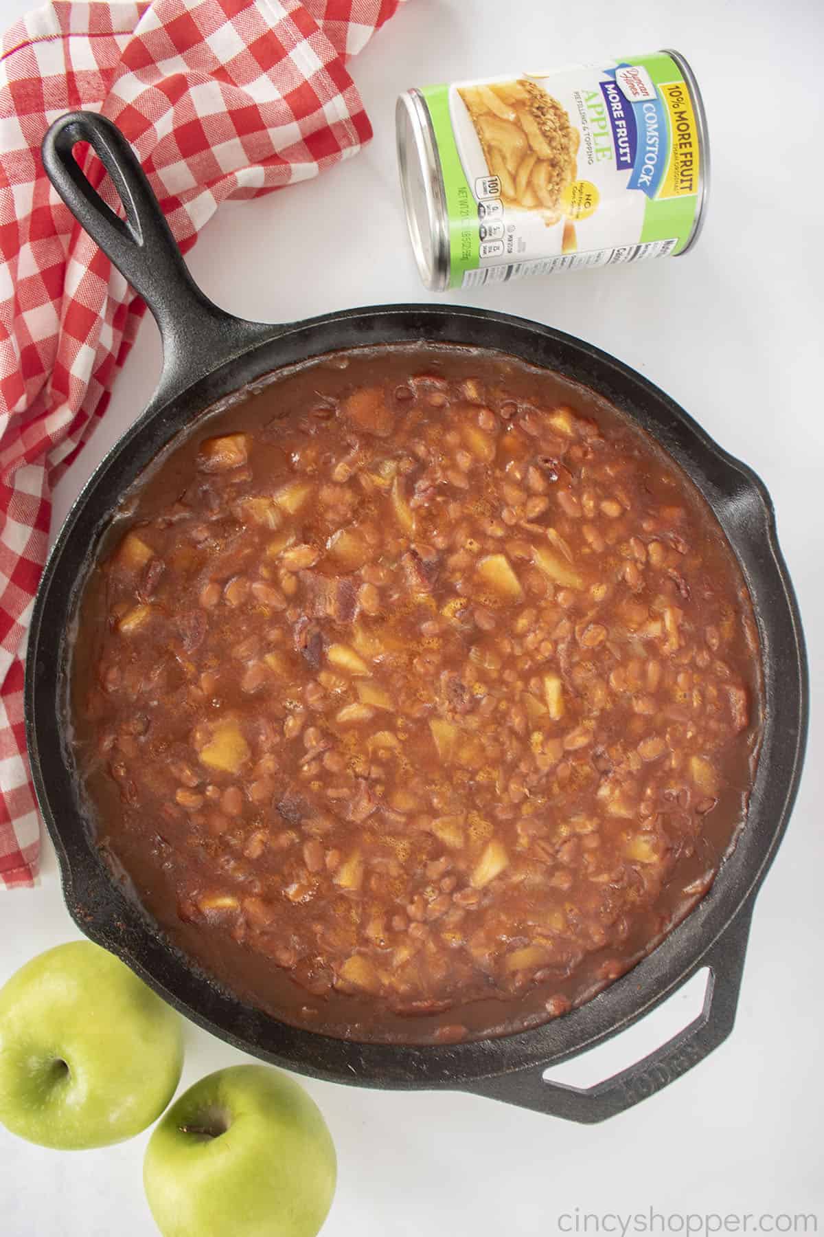 Apple Pie Baked Beans in a cast iron skillet.