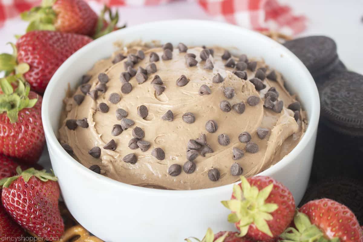 Brownie Dip in a white bowl with mini chocolate chips.