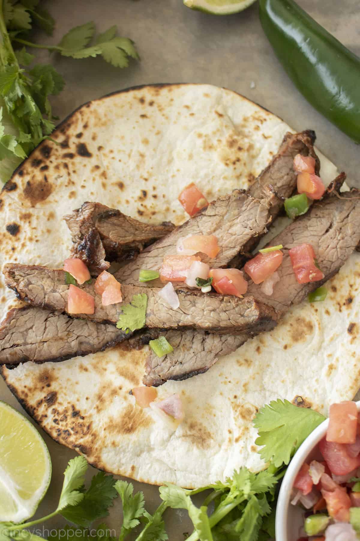 Grilled Carne Asada on a tortilla.