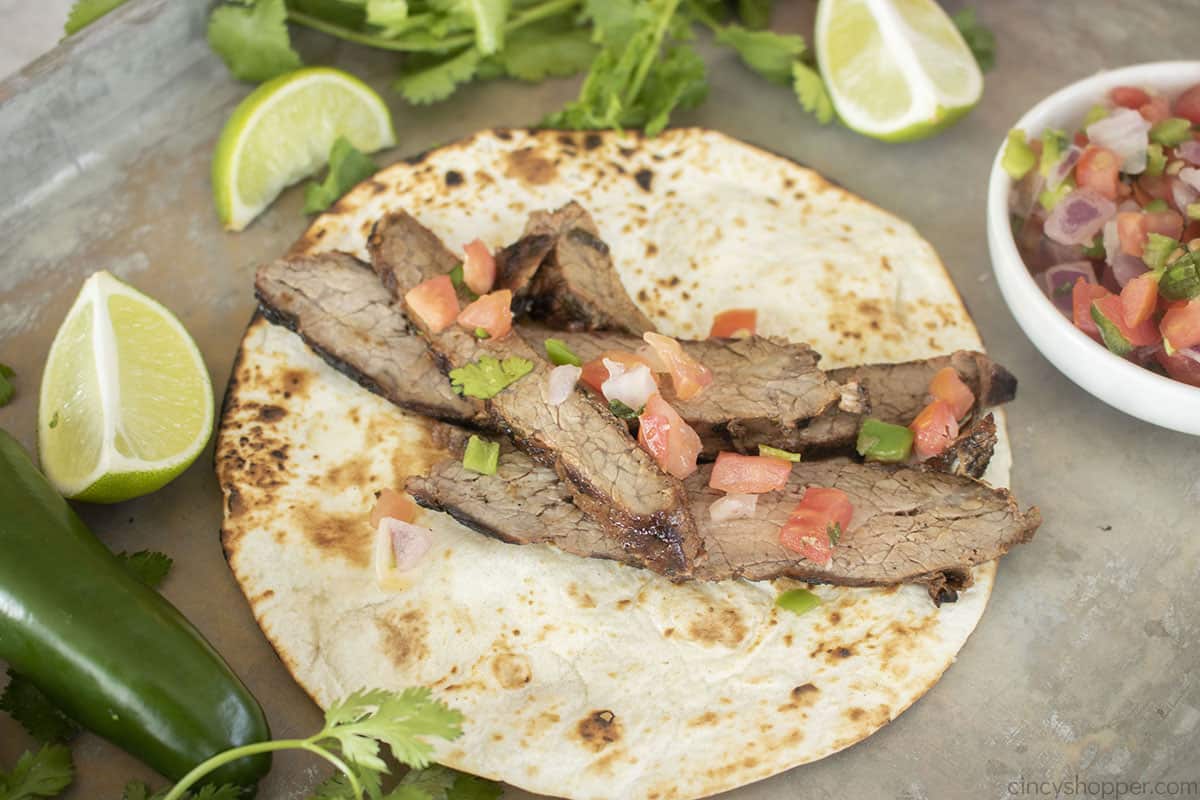 Carne Asada with pico de gallo on a warm tortilla.