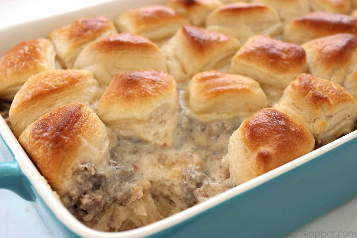 Teal baking dish with breakfast buiscuit and gravy casserole.