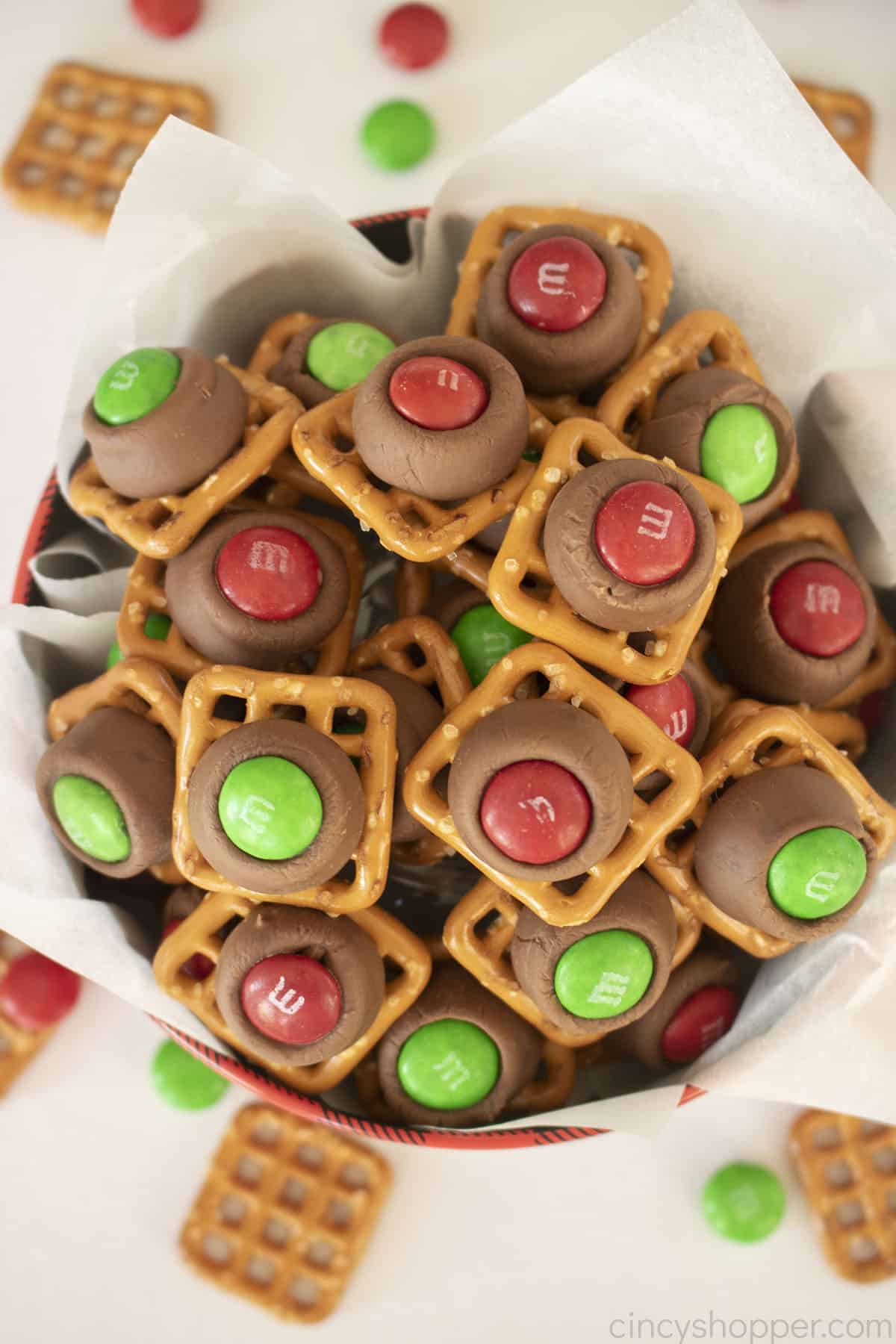 In close on Hershey Kiss pretzels with red and green M&M's.