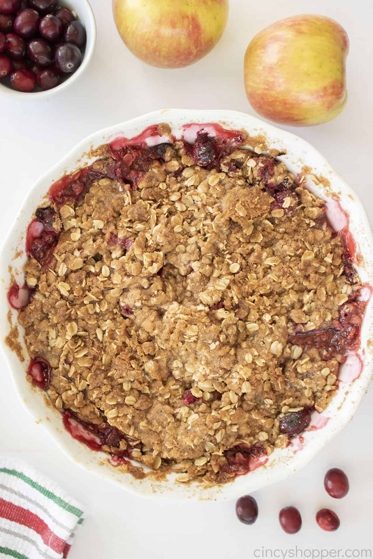 Apple Cranberry Crisp in a white pie plate.