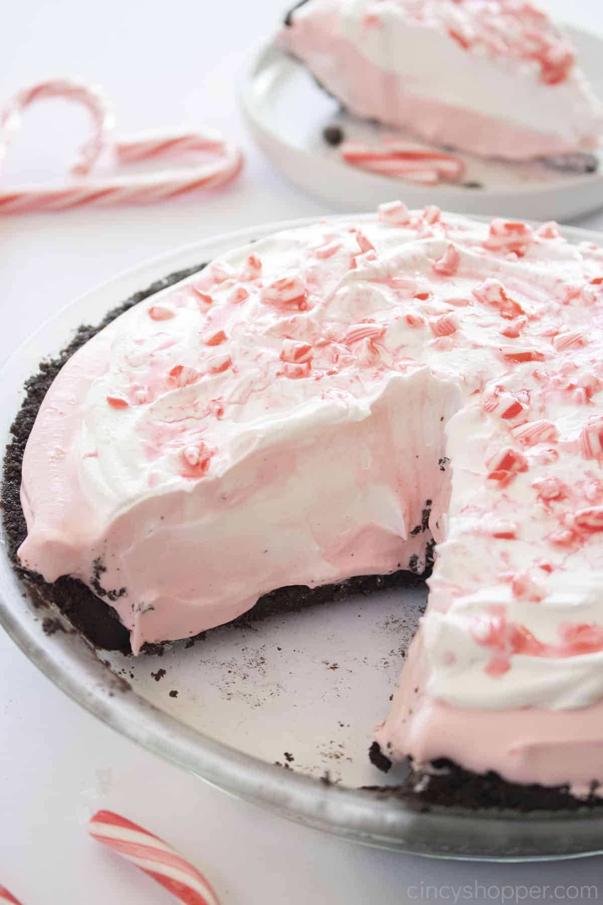 Whole Candy Cane Pie with one slice missing.