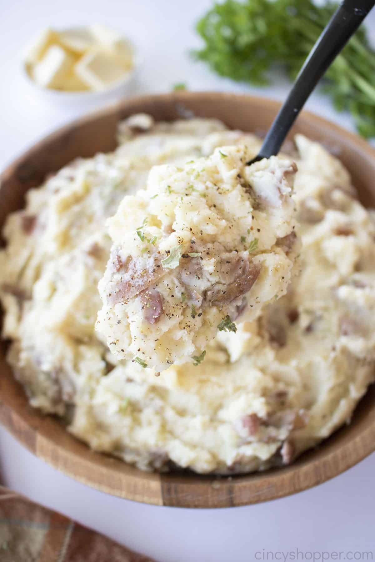 Red Skinned Mashed Potatoes on a spoon.