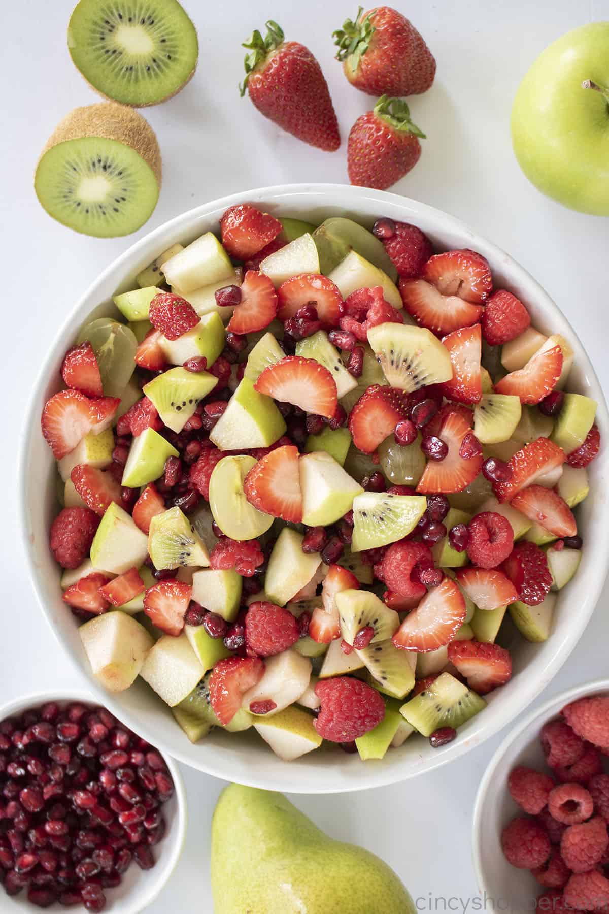 Christmas Fruit Salad in a white bowl.
