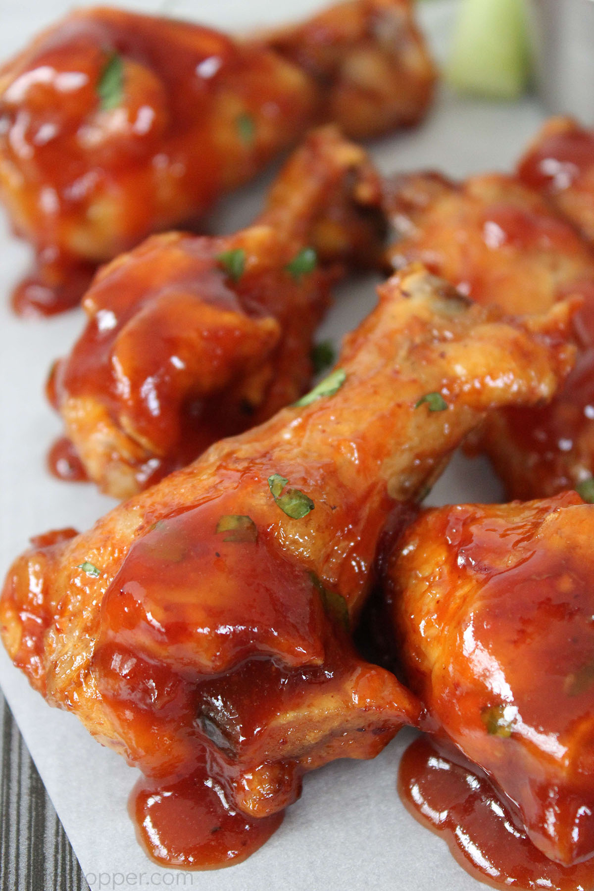 Boiled Chicken Wings that have been baked and sauced.