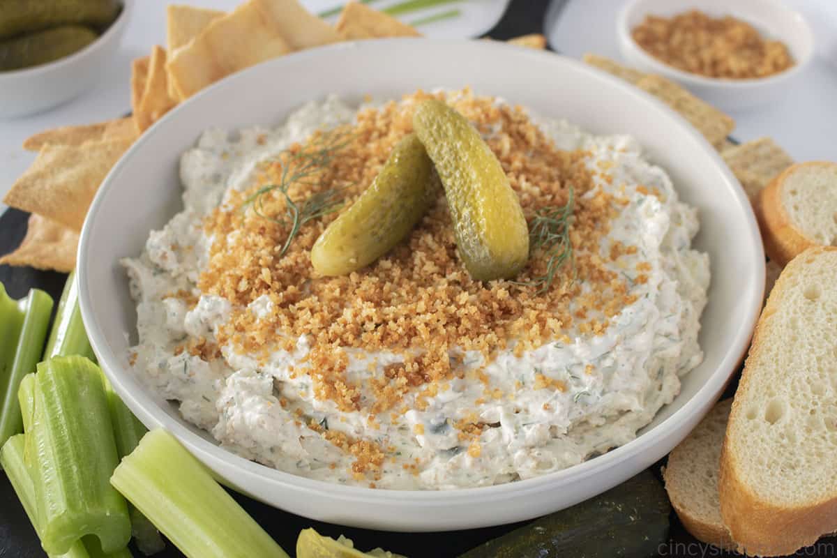 White bowl with fried pickle dip.