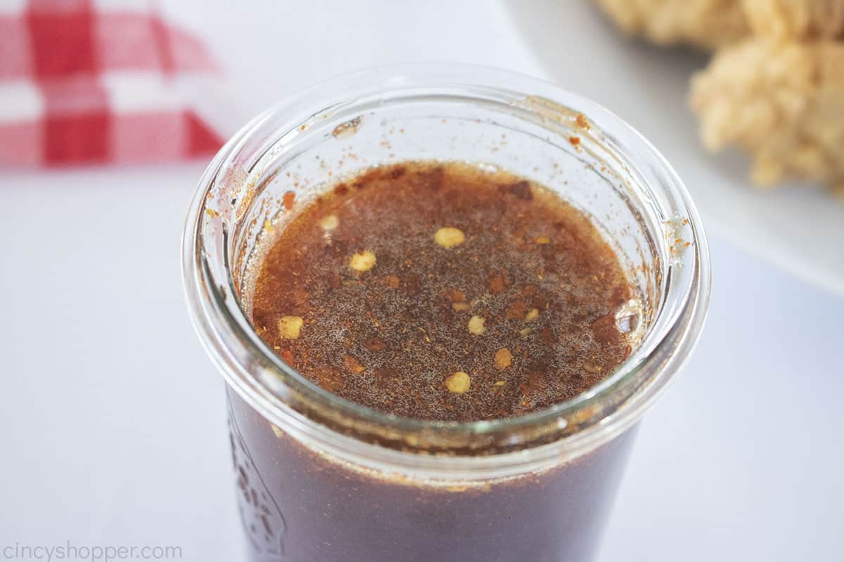Spice sauce with honey and peppers in a jar.