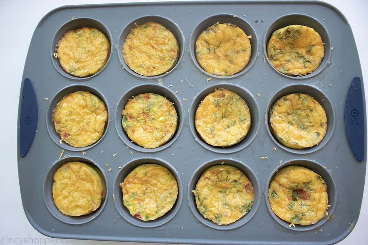 Cooked egg bites in a muffin pan.