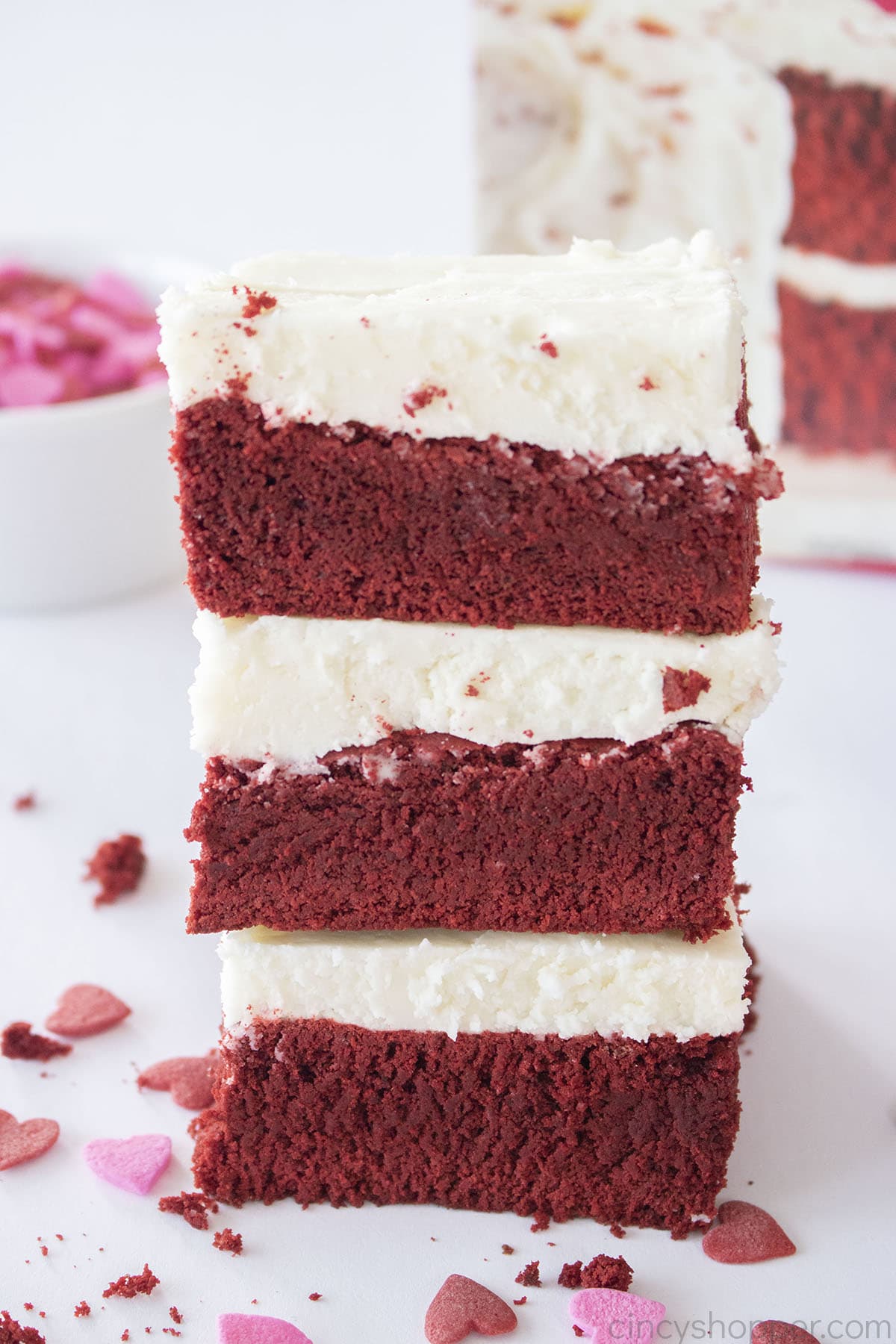 Stack of Red Velvet Brownies with Cream Cheese Frosting.