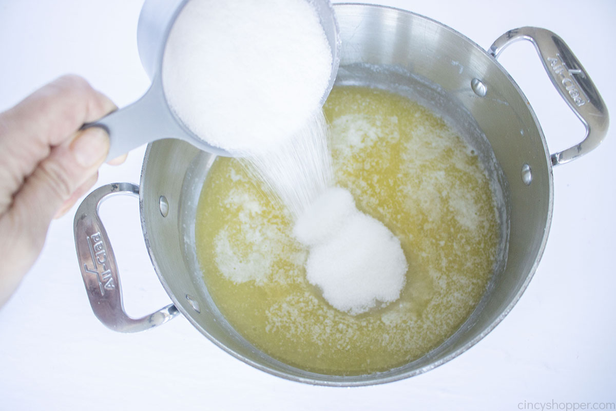 Sugar added to melted butter in a saucepan
