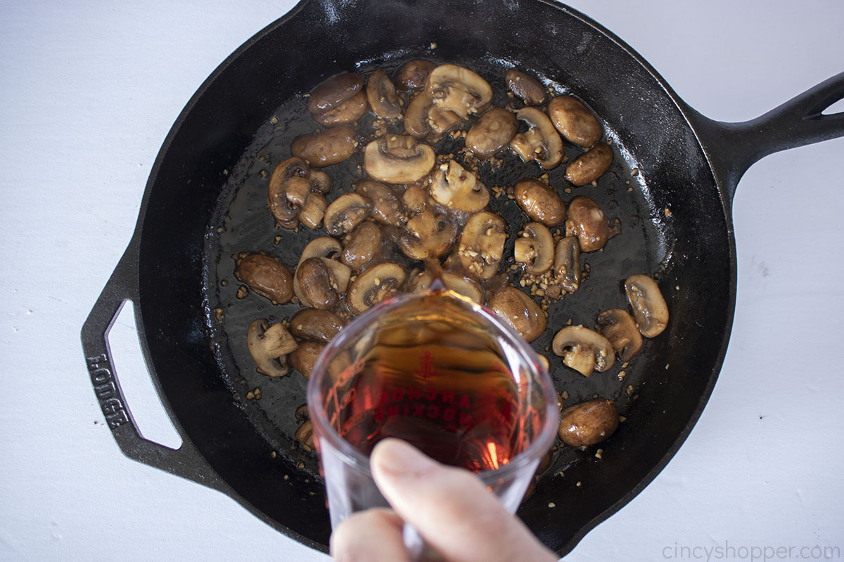 Marsala wine added to cooked mushrooms.