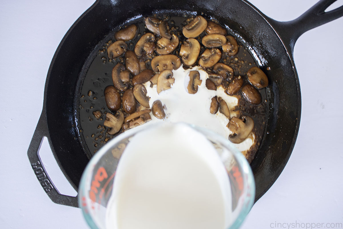 Heavy cream added to Marsala mushrooms.
