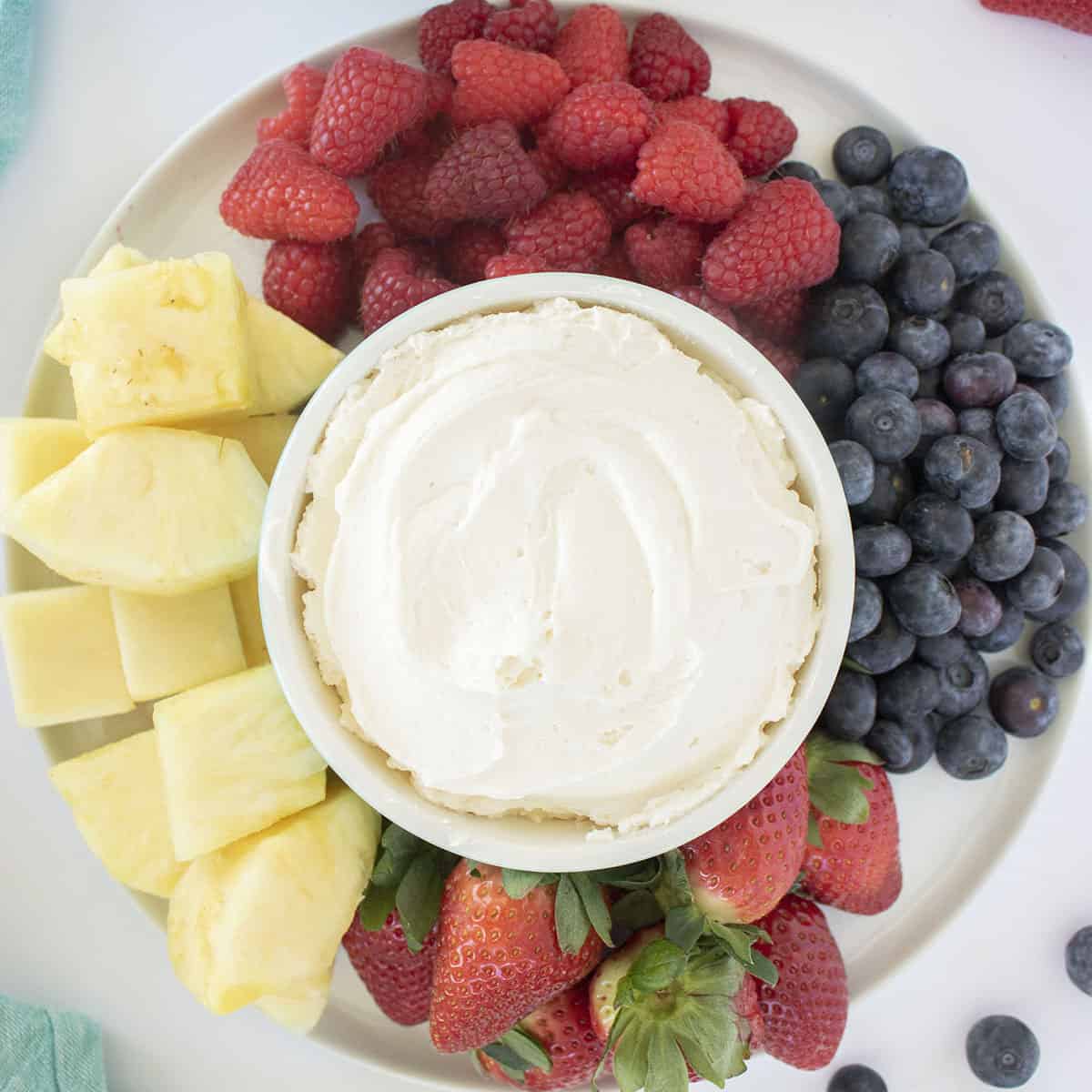 Cool Whip Fruit Dip on a platter with fresh fruit.