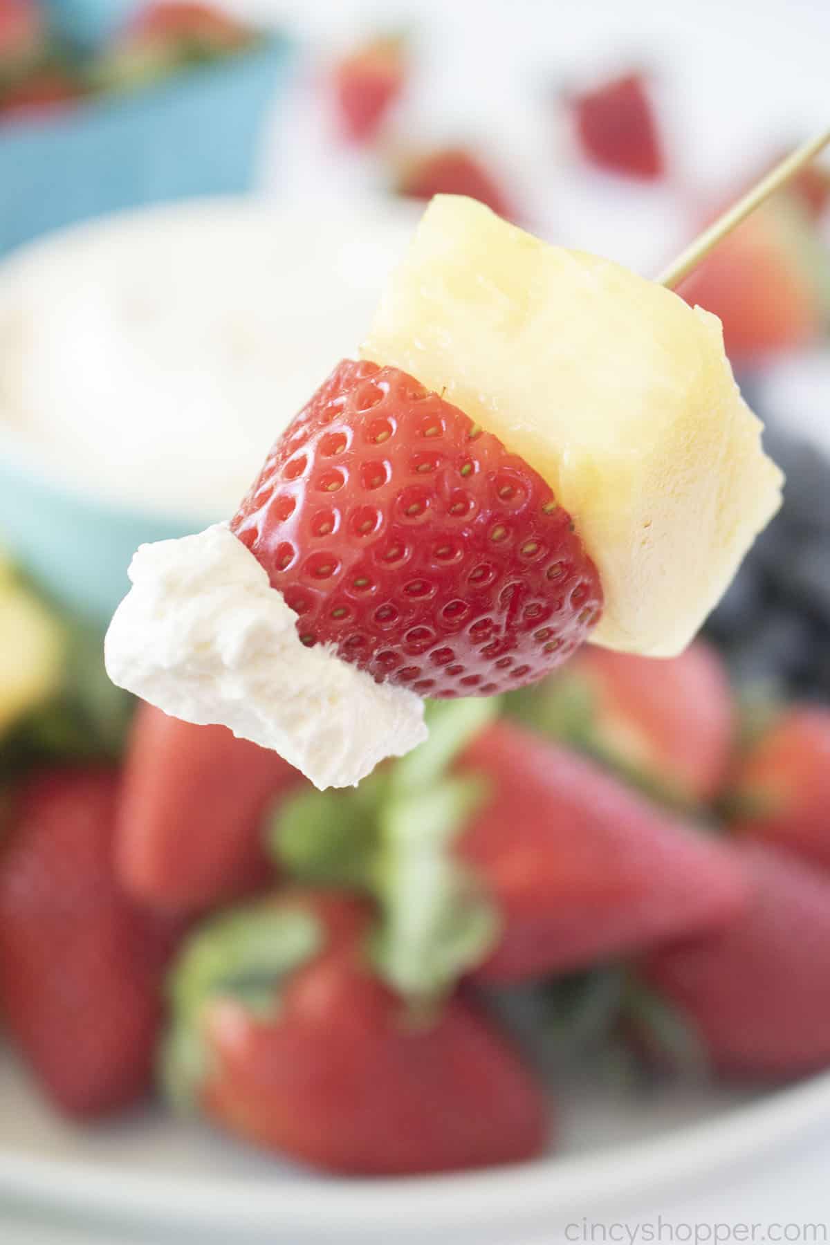 Strawberry and Pineapple on a skewer with Cool Whip Dip.