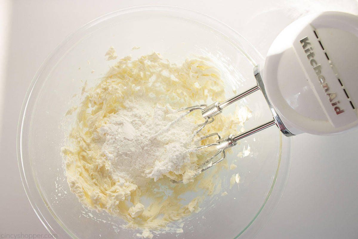 Powdered sugar added to cream cheese dip mixture.