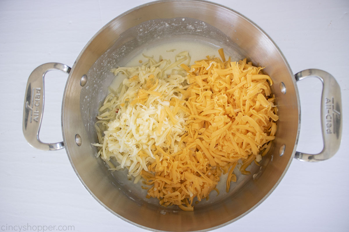 Shredded cheeses added to the bechamel sauce.