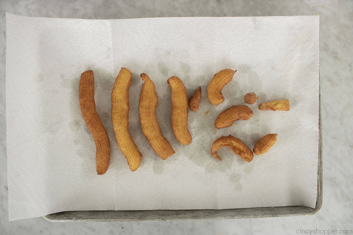 Fried Churros on a paper towel.