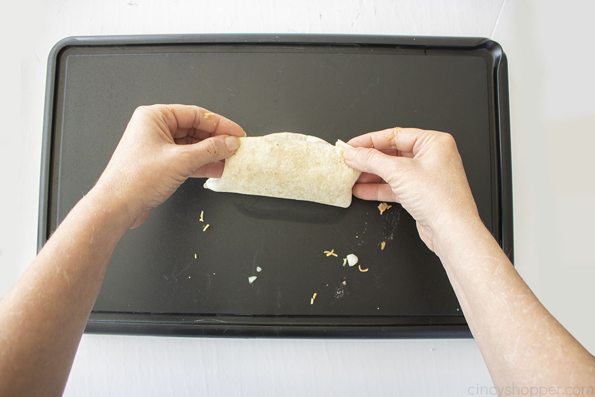Folding bean burrito.