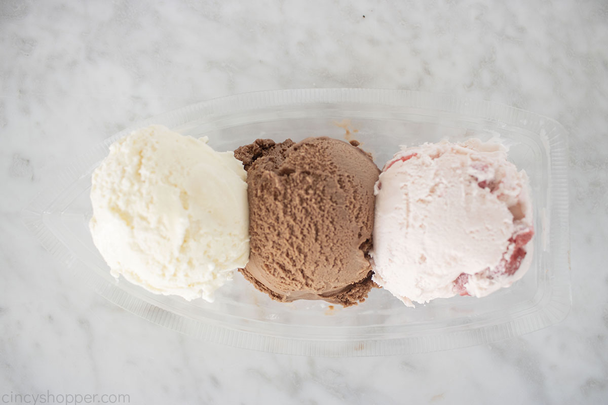 Ice cream scoops in a banana boat.