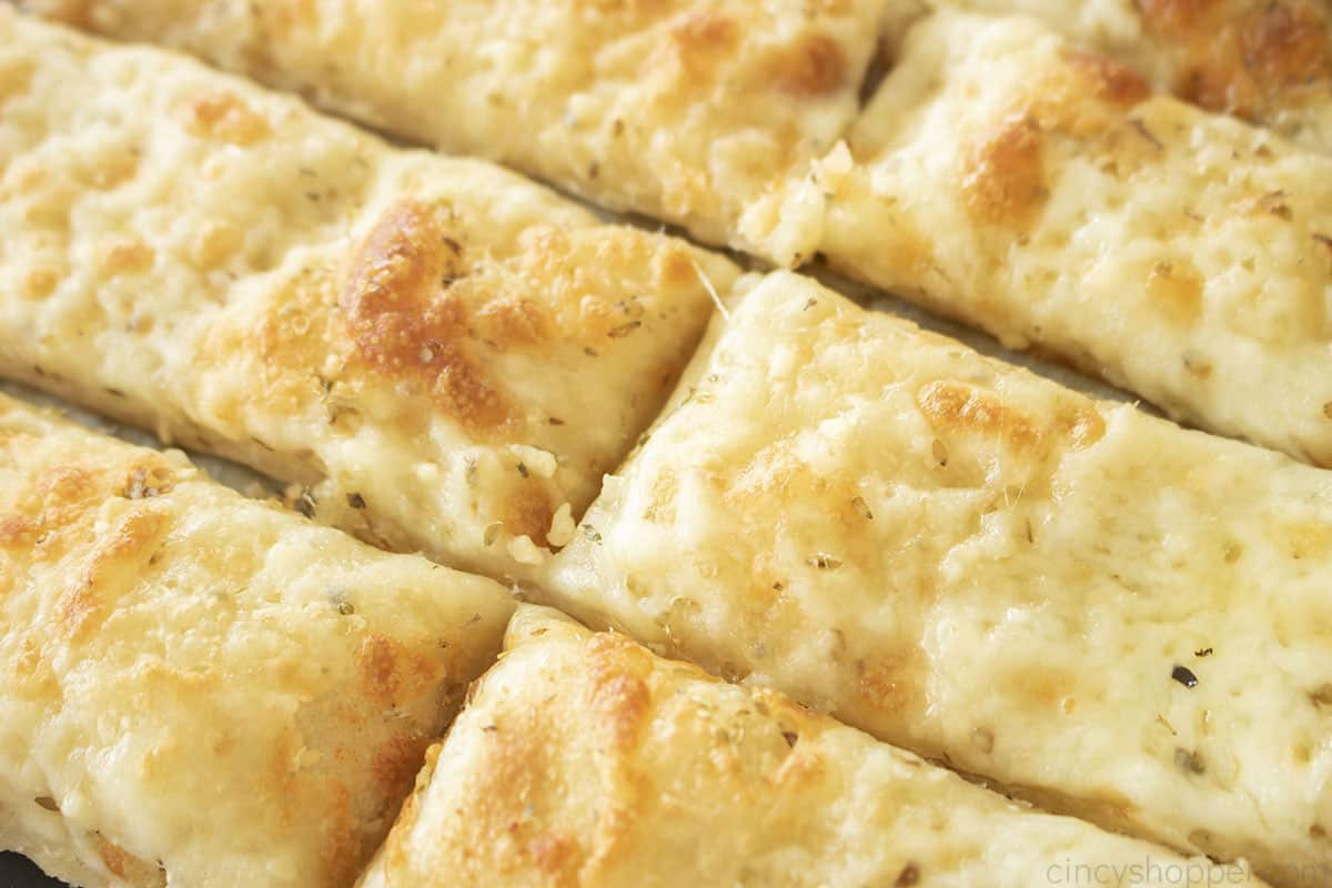 Slices of baked Cheesy Garlic Breadsticks.