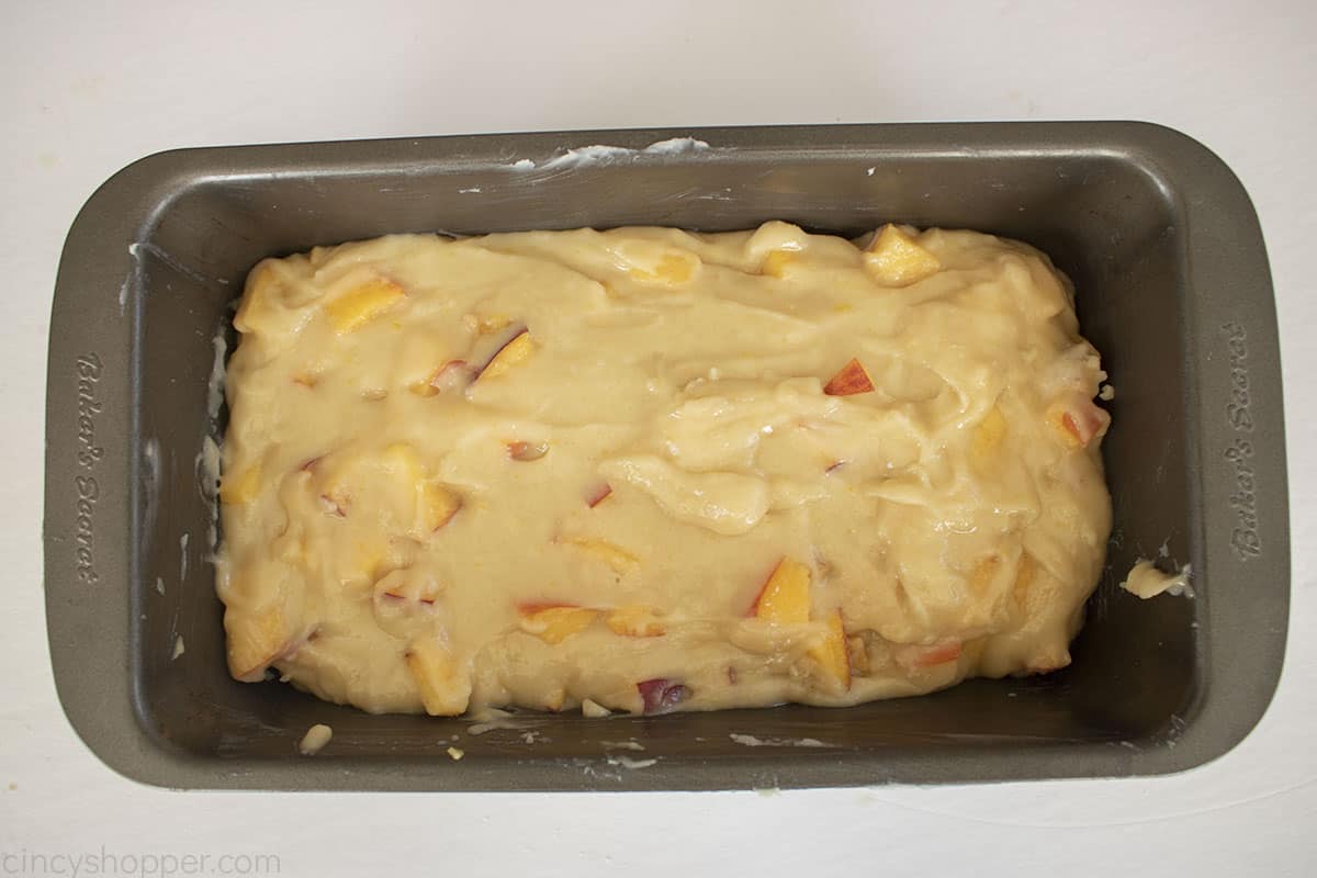 Peach Bread batter in a loaf pan.