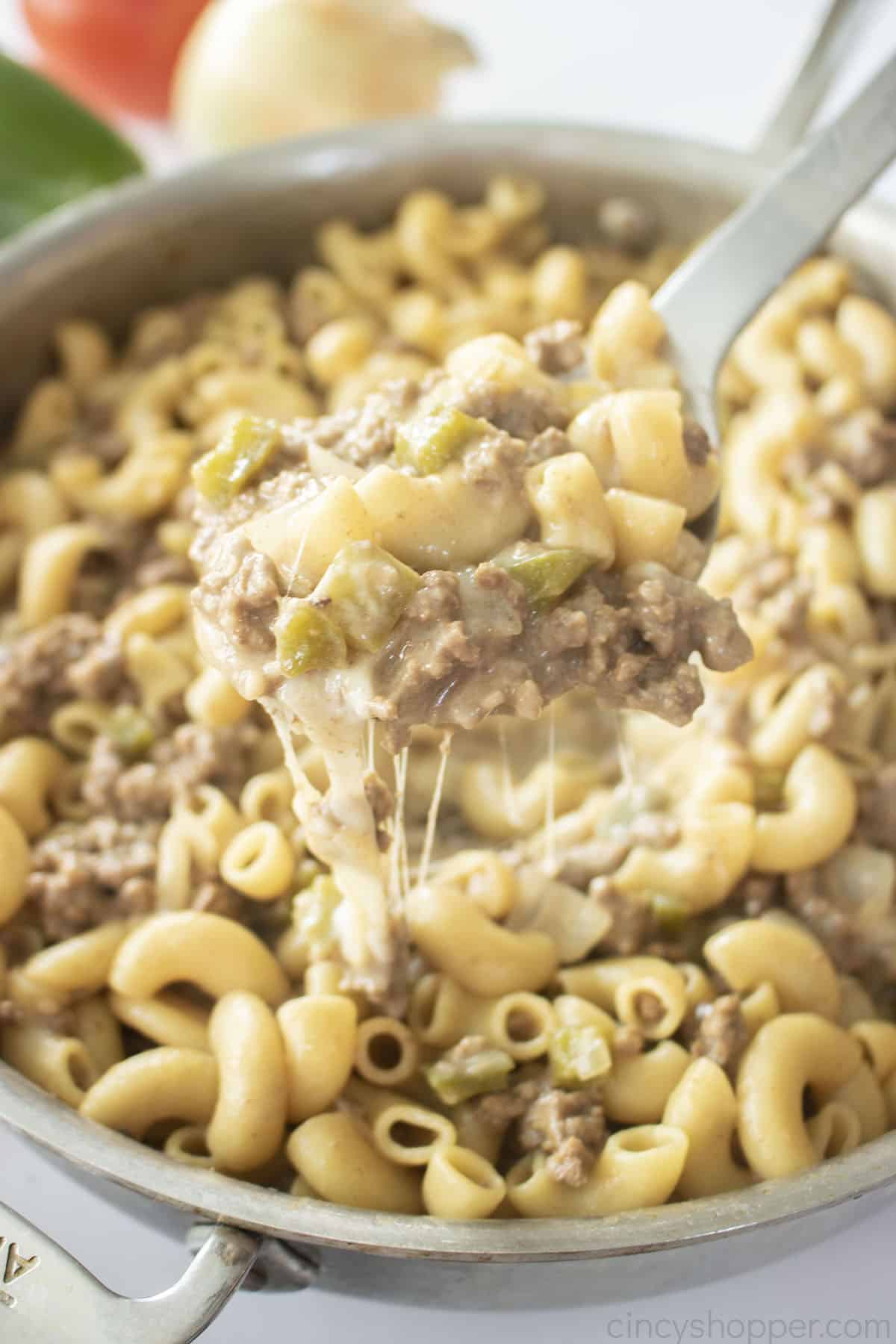 Philly Cheese Steak Pasta on a metal spoon.