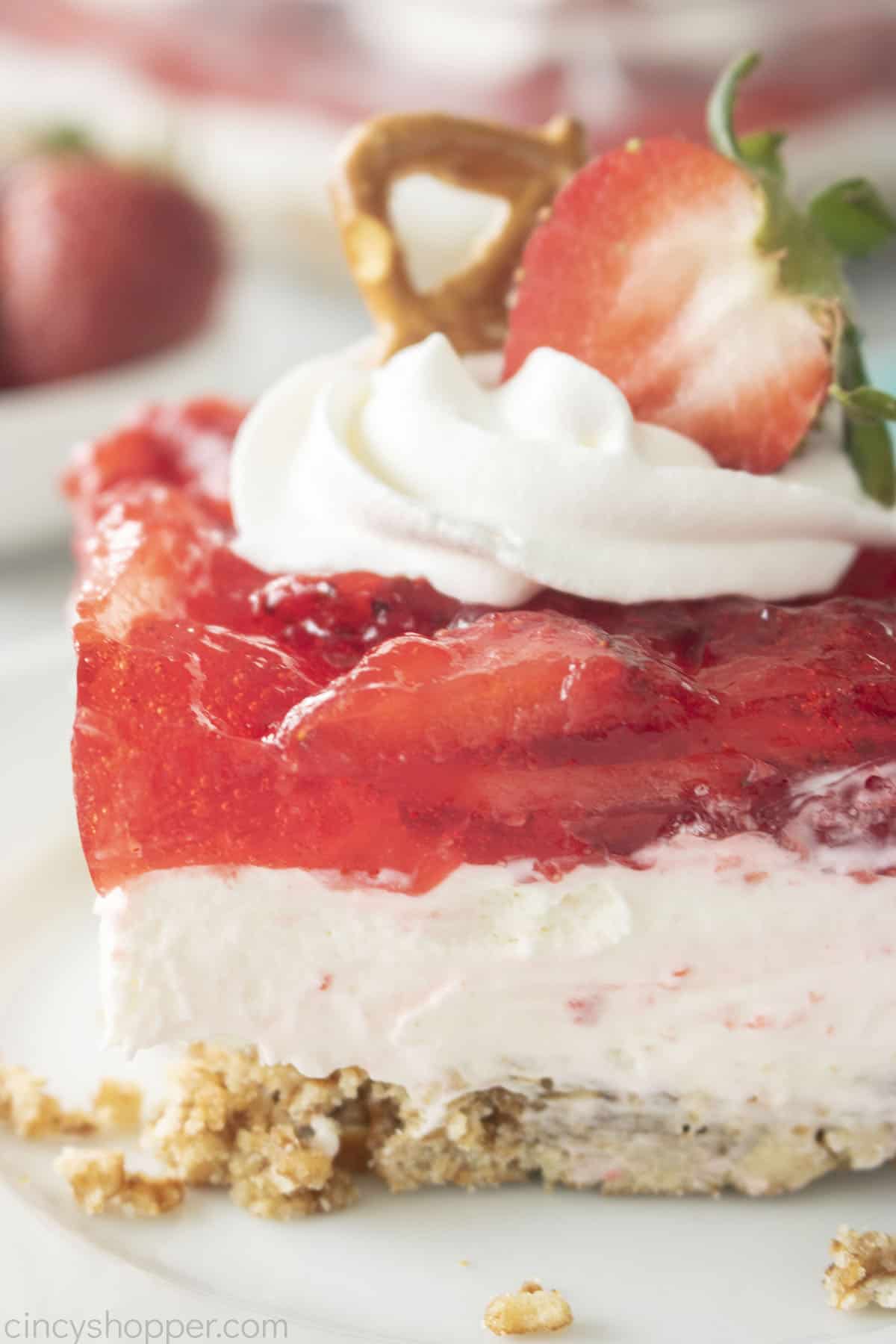 Slice of Jello Strawberry Pretzel Salad on a plate.