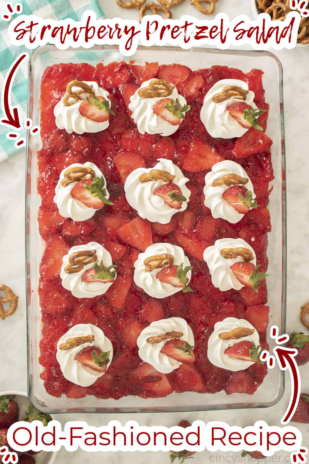 Clear baking pan with Strawberry Jello dessert salad.