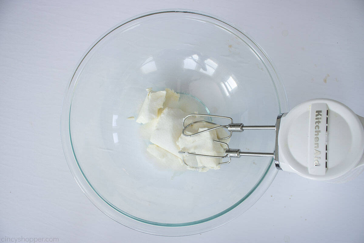 Cream cheese and sugar with mixer .