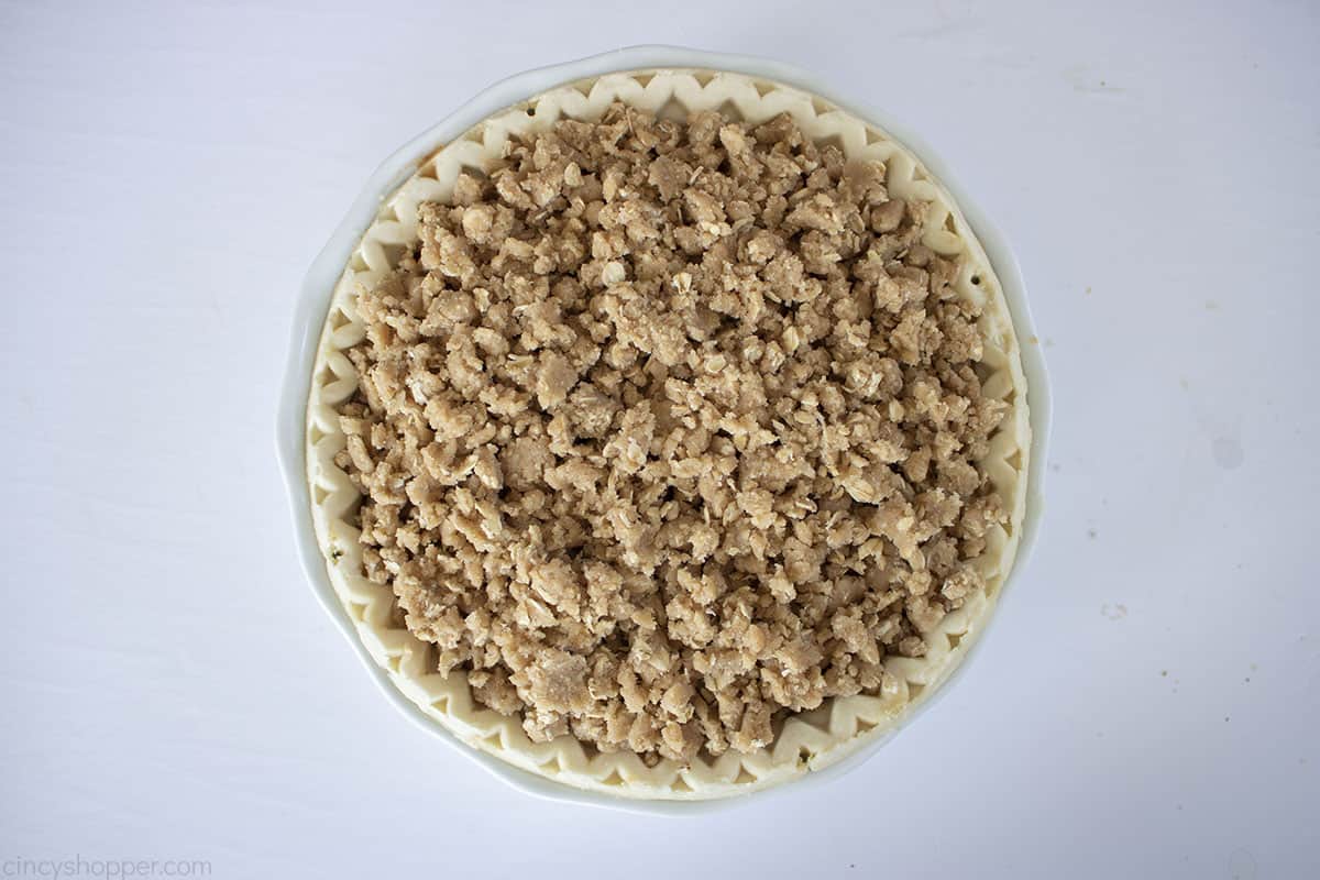 Crumb topping added on to the top of the apple pie filling.