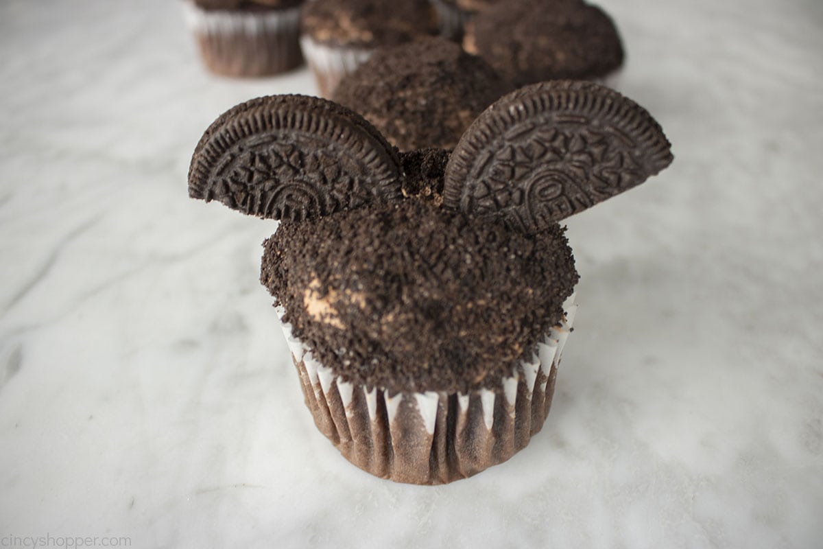 Bat wing Oreo Cookies topped on cupcake.