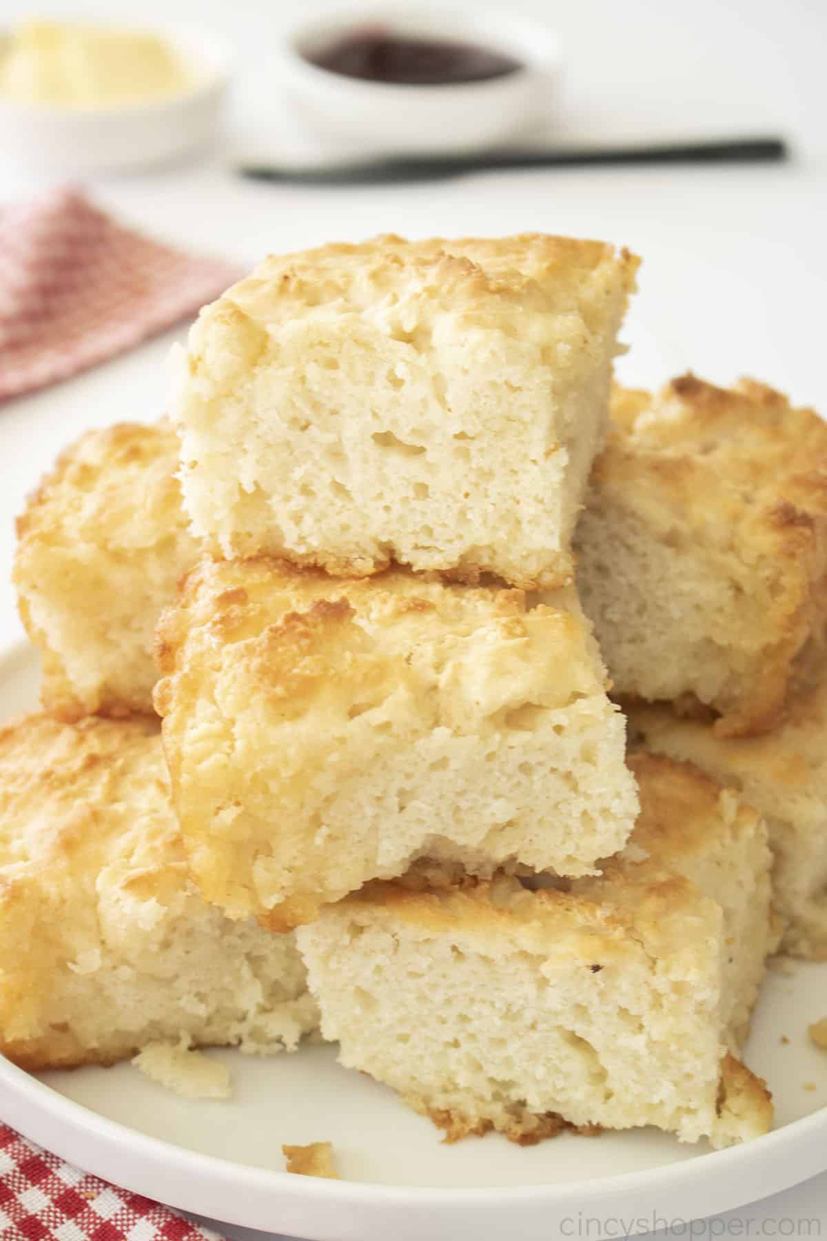 Stack of Butter Swim Biscuits on a white plate.