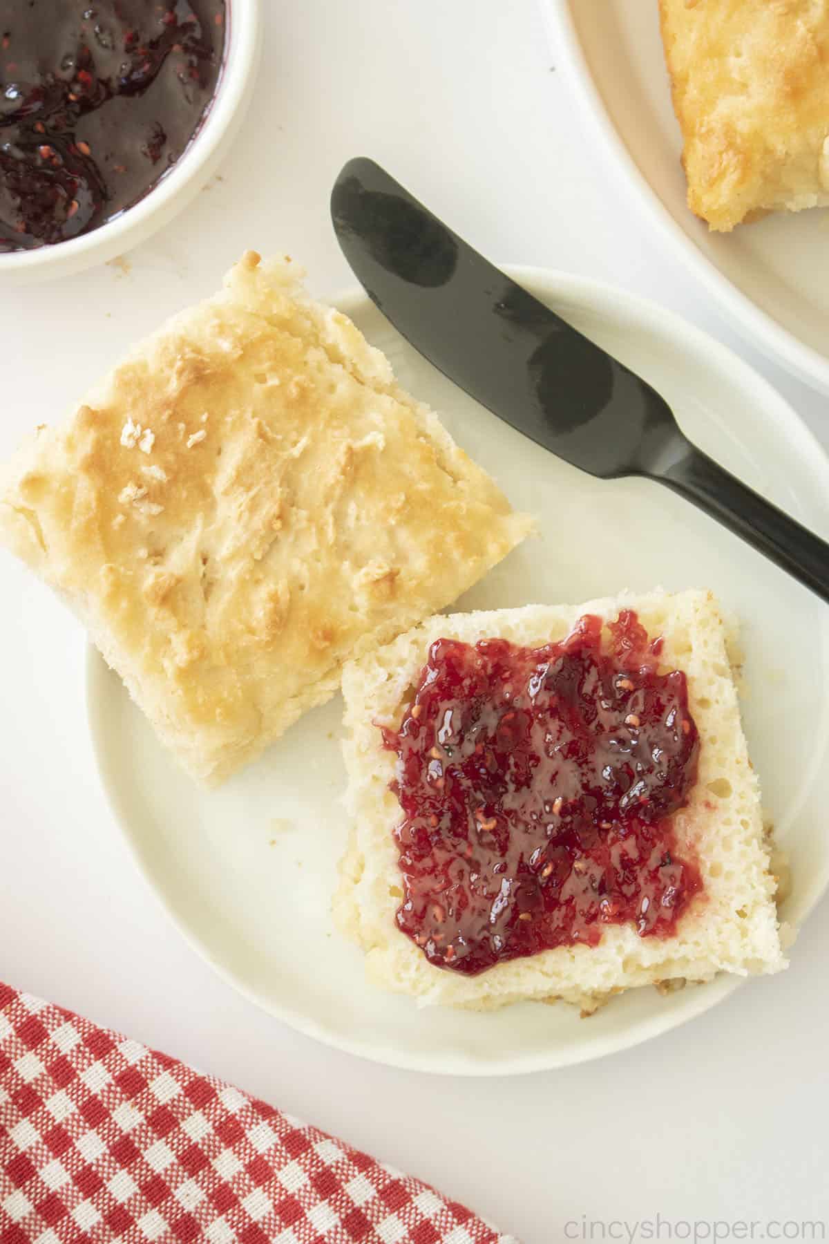 Butter Swim Biscuit topped with raspberry jam.